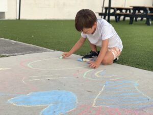 Trey with sidewalk chalk